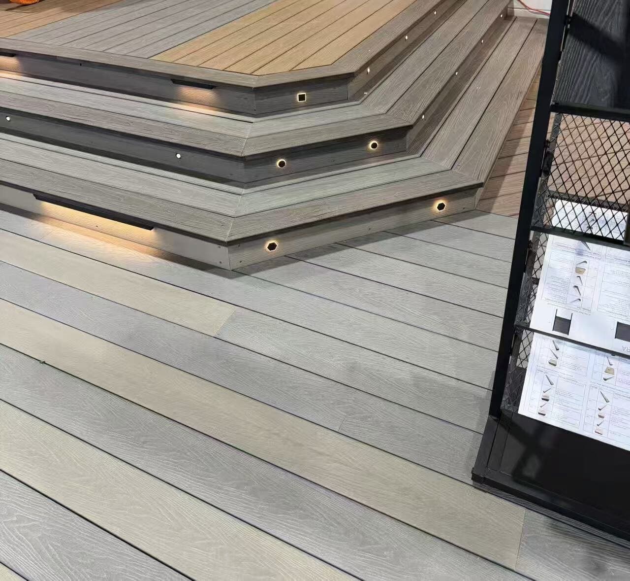 Tiered composite deck steps with recessed LED lighting