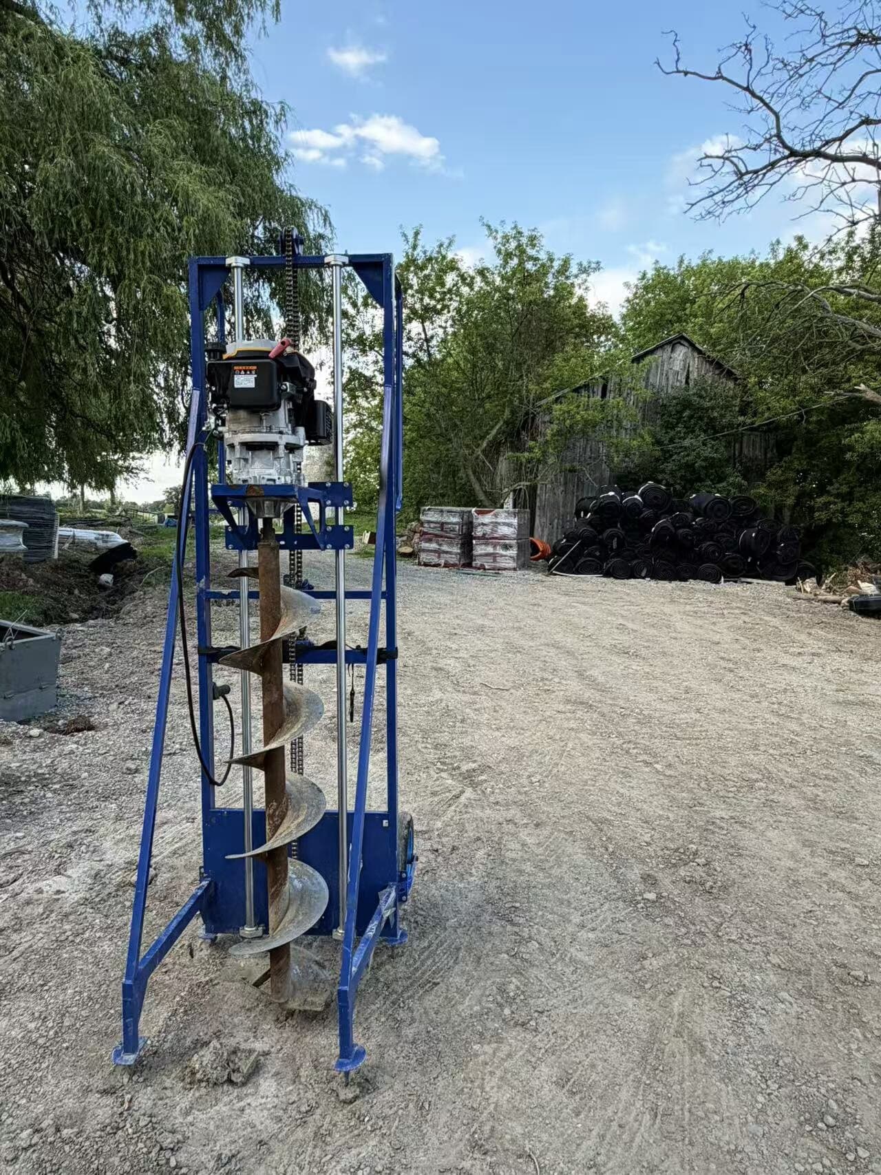 Towable hydraulic post-hole auger drill