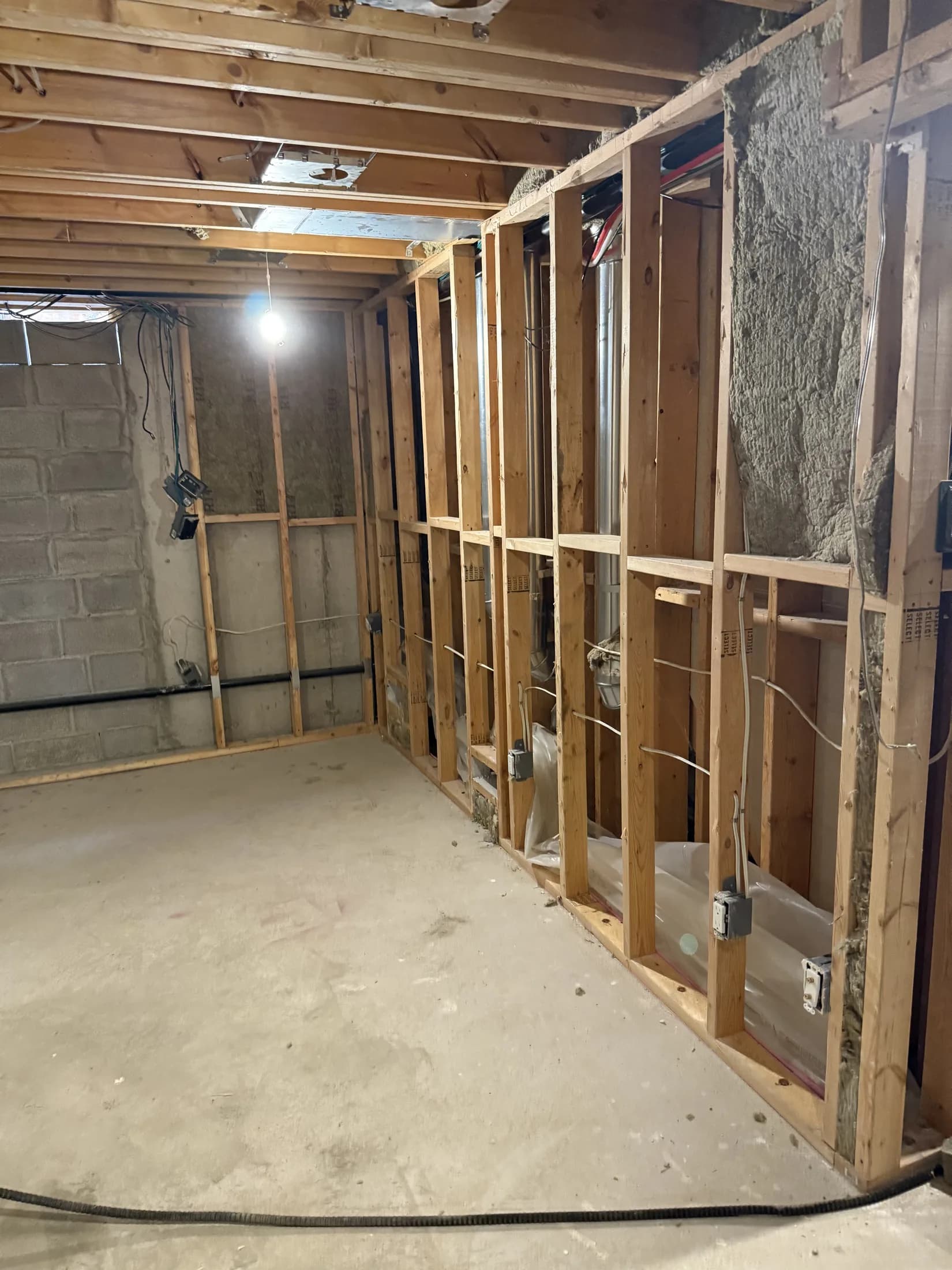 Basement renovation during framing and rough-in coordination